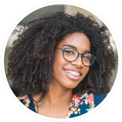 Girl wearing traditional metal braces - vs invisible braces.