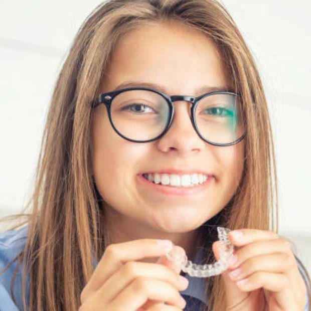Smiling girl with retainers